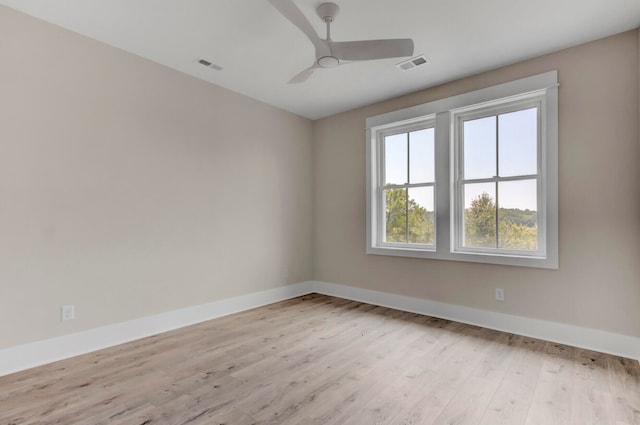 unfurnished room with ceiling fan and light hardwood / wood-style flooring