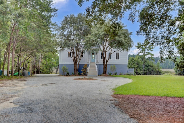 split foyer home with a front lawn