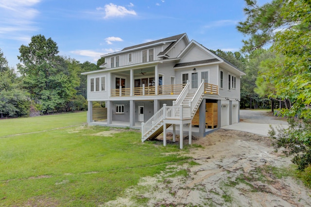 view of front facade featuring ceiling fan, a front lawn, and a garage