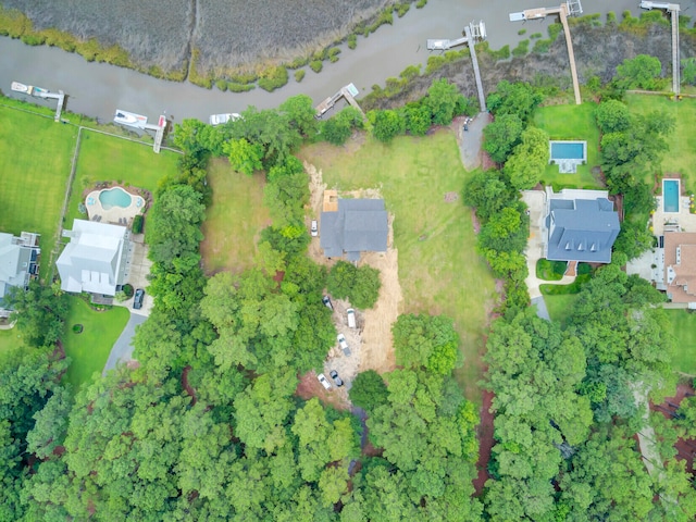 birds eye view of property with a water view