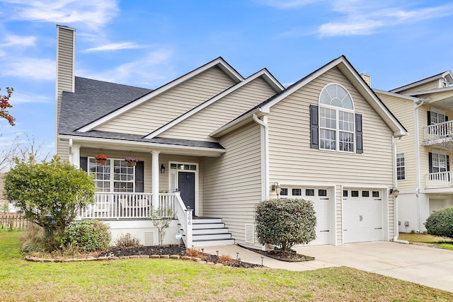 view of front of property with a chimney, a porch, concrete driveway, and an attached garage