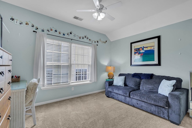 carpeted living room featuring visible vents, baseboards, lofted ceiling, and a ceiling fan