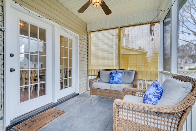 sunroom featuring a ceiling fan