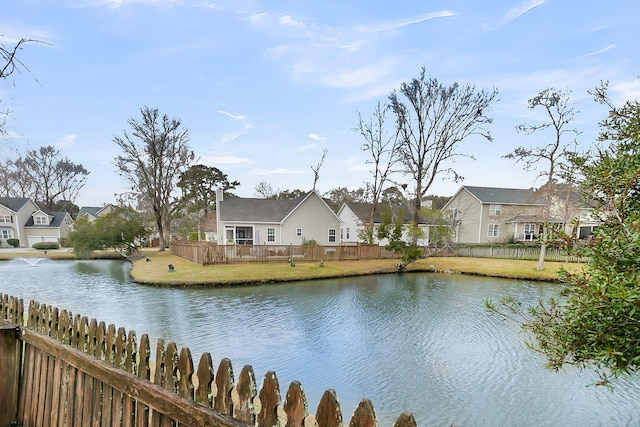 view of water feature featuring a residential view and fence