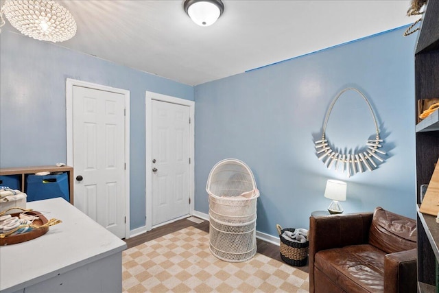 interior space with hardwood / wood-style flooring and a notable chandelier