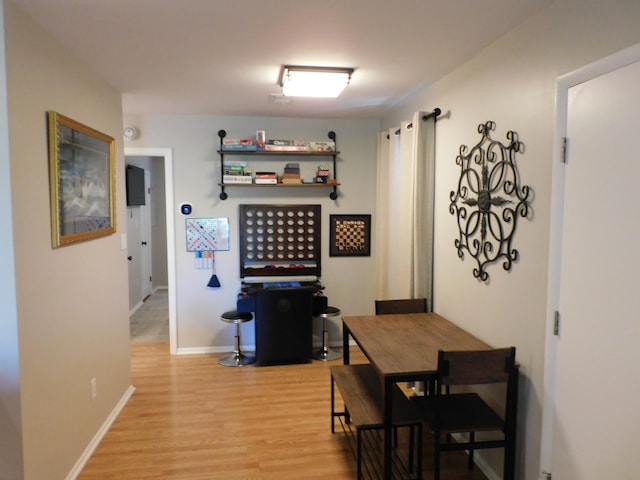 dining area with light hardwood / wood-style floors