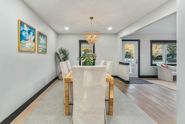 dining room featuring a chandelier and hardwood / wood-style floors