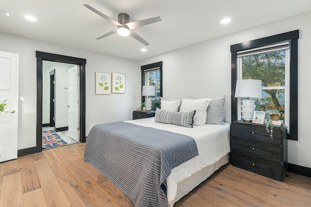 bedroom featuring ceiling fan and light hardwood / wood-style flooring