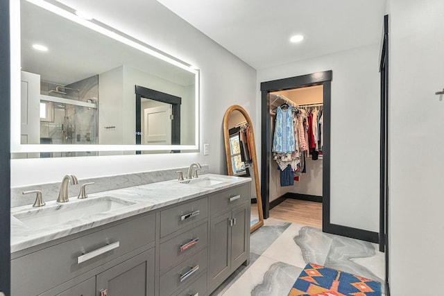 bathroom featuring vanity and walk in shower