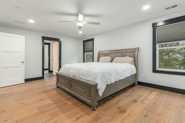 bedroom with ceiling fan and light wood-type flooring