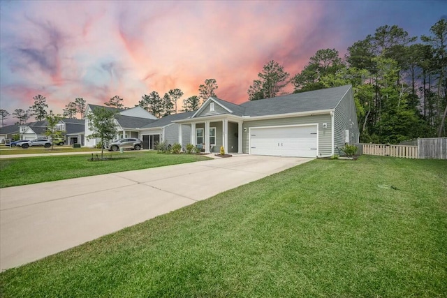 221 Lucca Dr, Summerville, SC 29486 - view of front facade featuring a yard, an attached garage, concrete driveway, and fence