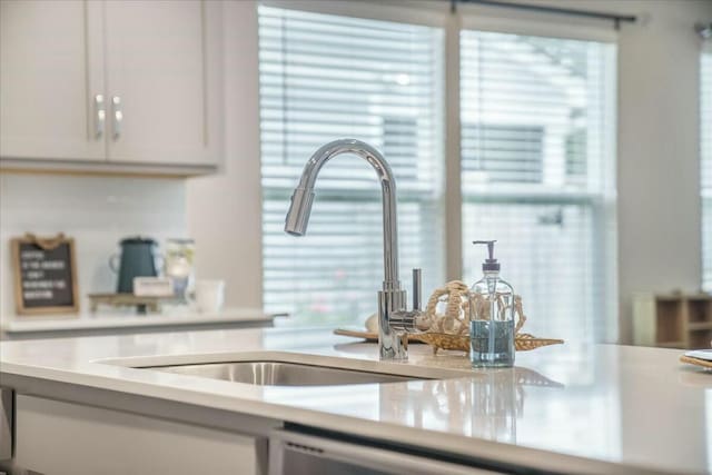 221 Lucca Dr, Summerville, SC 29486 - interior details featuring white cabinetry, a sink, and light countertops