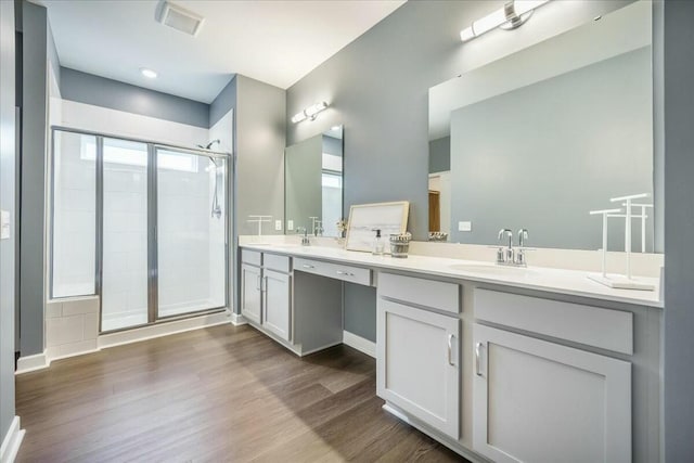 221 Lucca Dr, Summerville, SC 29486 - bathroom featuring wood finished floors, a sink, a shower stall, and double vanity