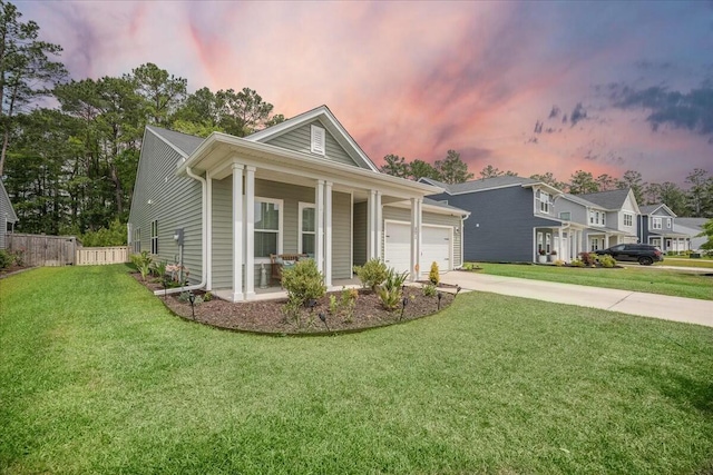 221 Lucca Dr, Summerville, SC 29486 - single story home with a porch, concrete driveway, fence, a garage, and a yard