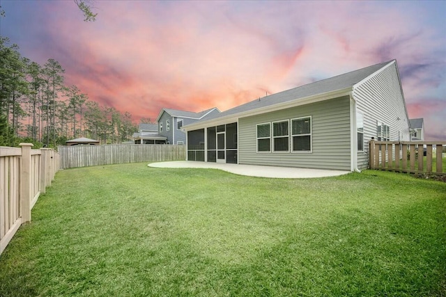 221 Lucca Dr, Summerville, SC 29486 - rear view of house featuring a fenced backyard, a sunroom, a patio area, and a yard
