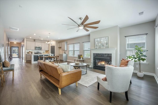 221 Lucca Dr, Summerville, SC 29486 - living area with a ceiling fan, visible vents, a fireplace, and dark wood-style flooring