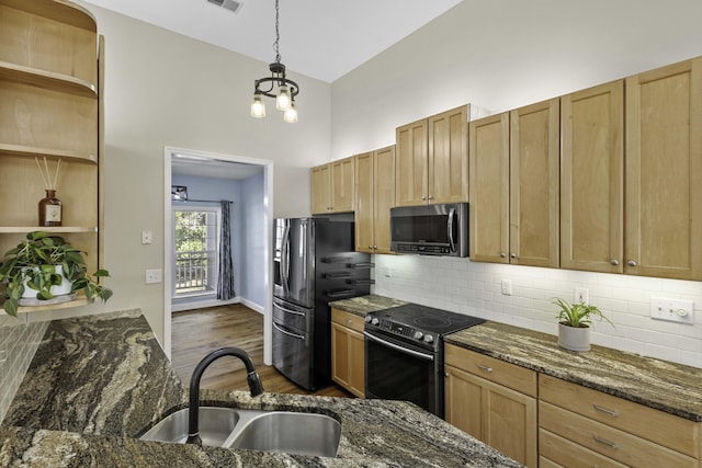 kitchen with a sink, open shelves, dark wood-style floors, appliances with stainless steel finishes, and decorative backsplash