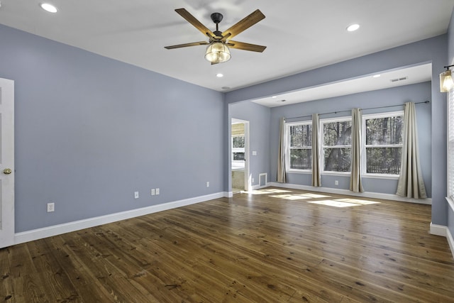 spare room with recessed lighting, baseboards, and hardwood / wood-style floors