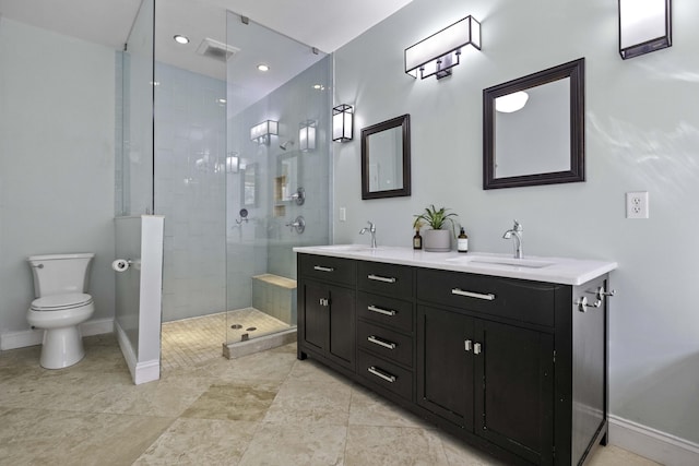 bathroom featuring double vanity, baseboards, a tile shower, and a sink