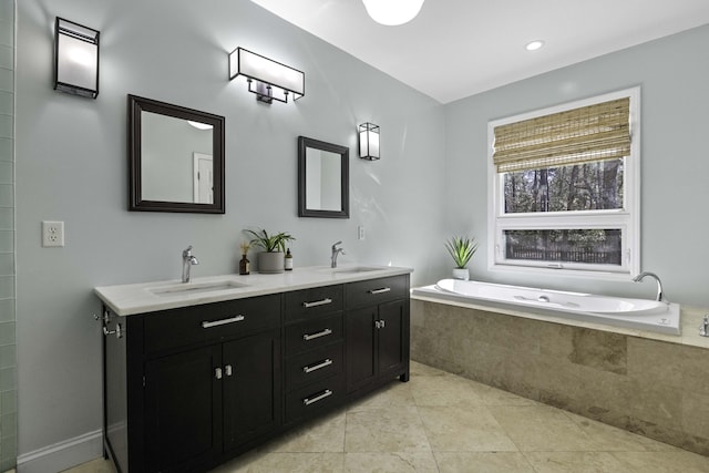 bathroom with a bath, tile patterned flooring, double vanity, and a sink