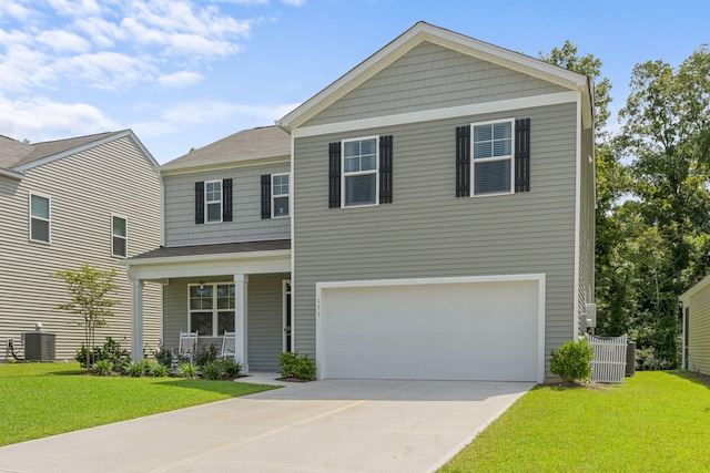 view of front of property featuring covered porch, a garage, central AC, and a front lawn