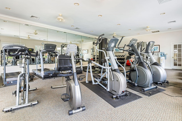 workout area featuring ornamental molding