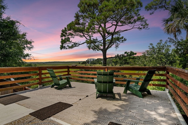 view of patio terrace at dusk