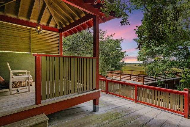 deck at dusk with a gazebo