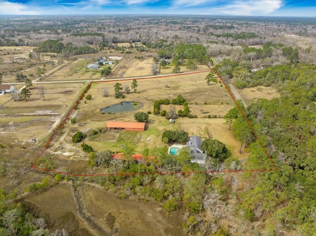 birds eye view of property with a rural view