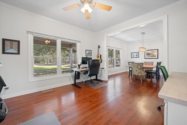 office space with a healthy amount of sunlight, visible vents, and wood finished floors