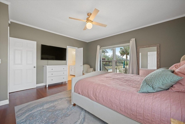 bedroom featuring access to exterior, crown molding, baseboards, and wood finished floors