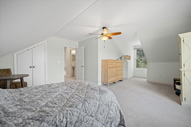 bedroom featuring light carpet, lofted ceiling, a ceiling fan, and baseboards