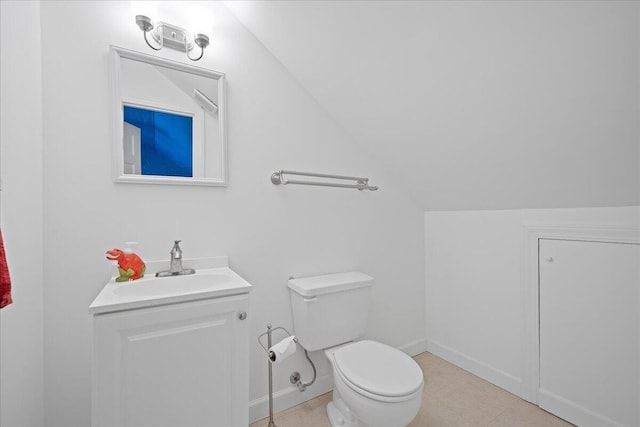 half bath featuring toilet, baseboards, vaulted ceiling, and vanity