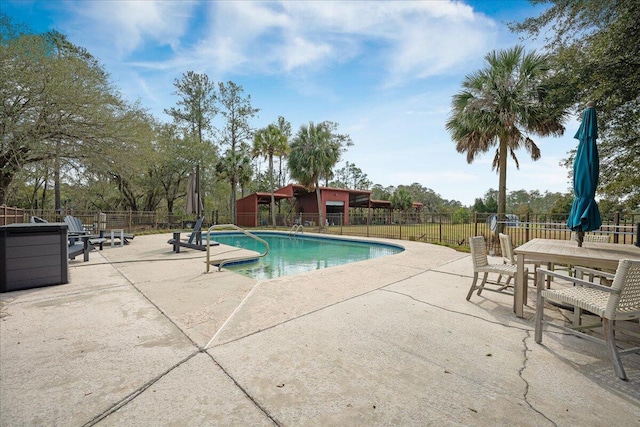 view of swimming pool with a fenced in pool, a patio area, and fence