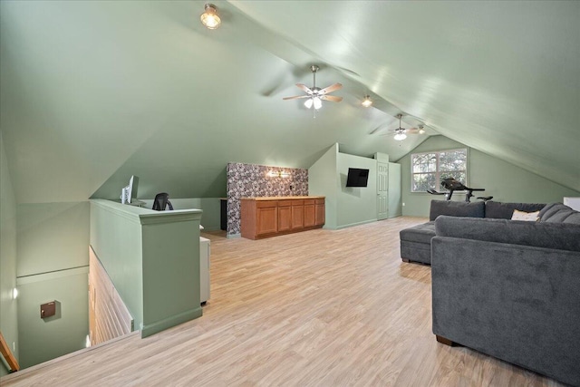 interior space featuring lofted ceiling and light wood-style flooring