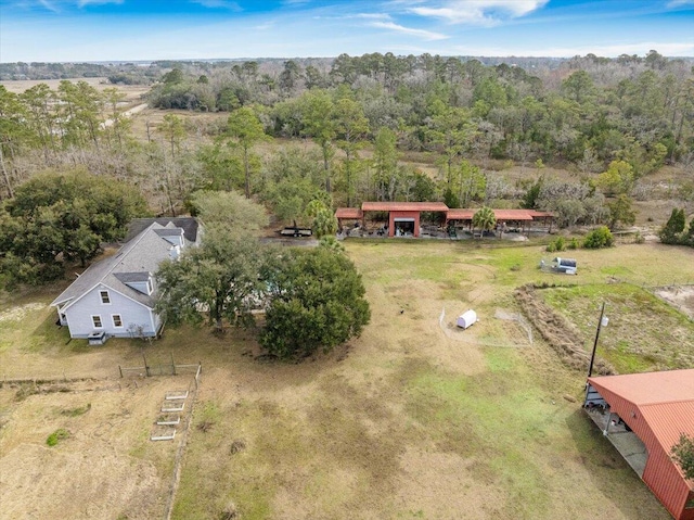 aerial view featuring a forest view and a rural view