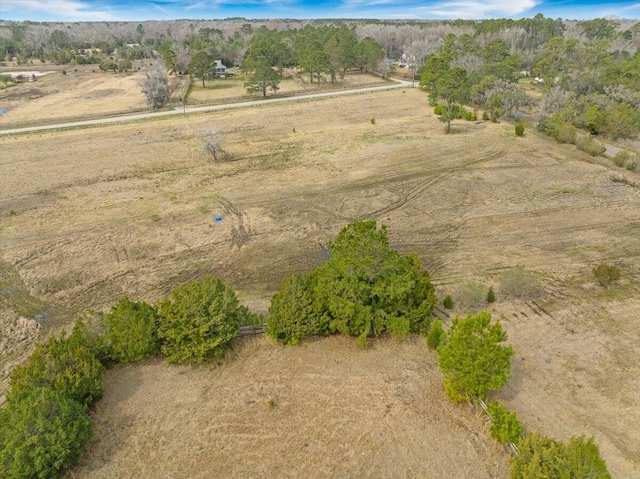 birds eye view of property featuring a rural view