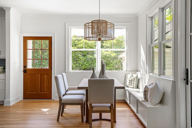517 Royall Ave, Mount Pleasant, SC 29464 - dining area with light wood-type flooring, ornamental molding, a chandelier, and baseboards