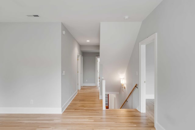 hall with light wood-type flooring