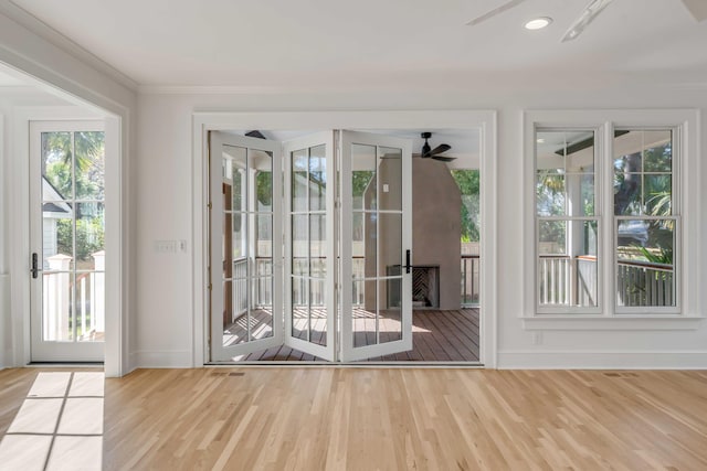 517 Royall Ave, Mount Pleasant, SC 29464 - doorway to outside with ceiling fan, wood finished floors, baseboards, and ornamental molding