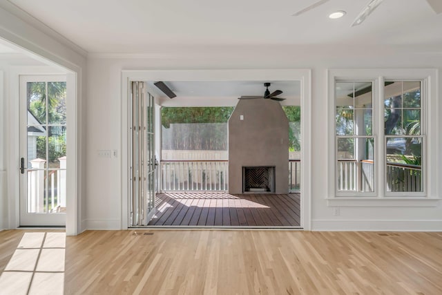 517 Royall Ave, Mount Pleasant, SC 29464 - entryway with ceiling fan, wood finished floors, baseboards, ornamental molding, and a large fireplace