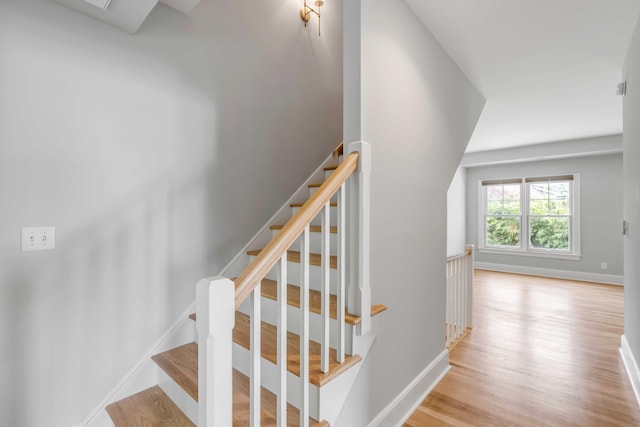 staircase featuring hardwood / wood-style flooring