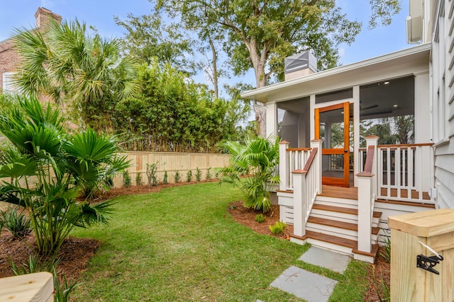 view of yard featuring a sunroom