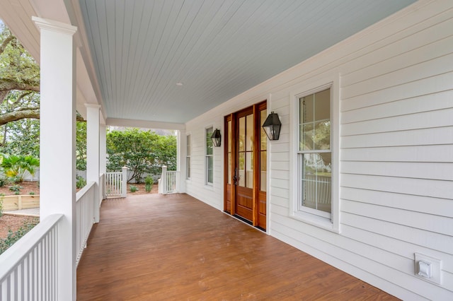 wooden terrace with a porch