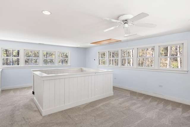 unfurnished bedroom featuring attic access, recessed lighting, baseboards, and light carpet