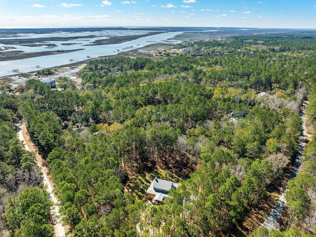 bird's eye view featuring a wooded view