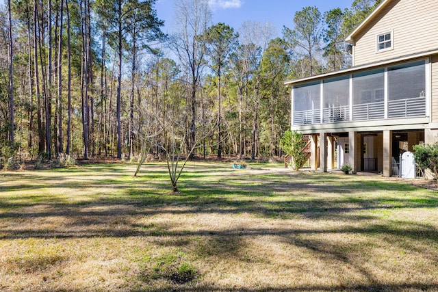 view of yard featuring a sunroom