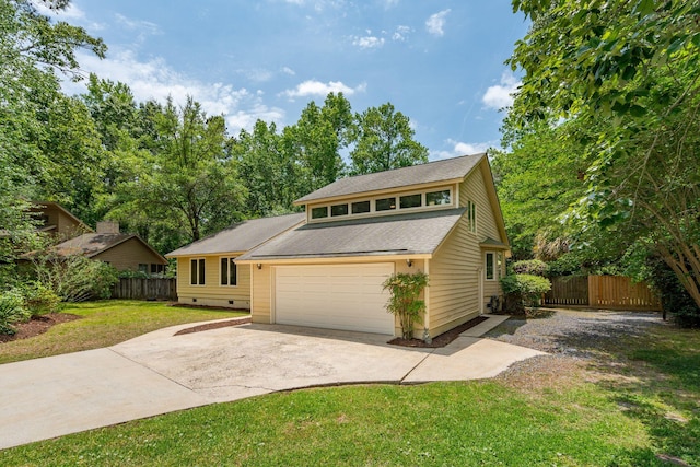 view of front facade with concrete driveway, a garage, and roof with shingles