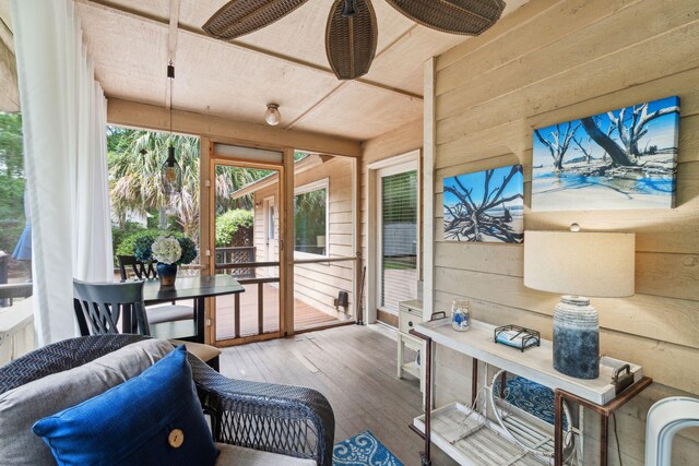 sunroom with a ceiling fan