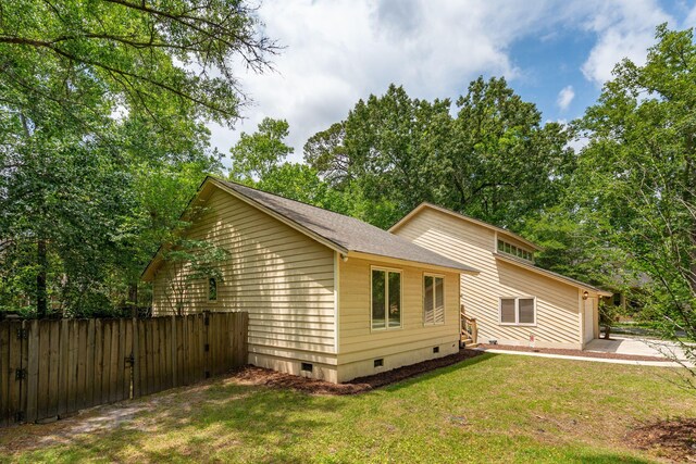 view of home's exterior with crawl space and a patio area
